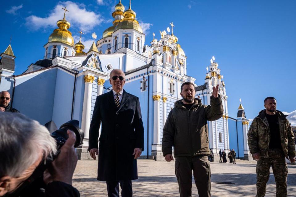 U.S. President Joe Biden walks next to Ukrainian President Volodymyr Zelensky in front of St. Michaels Golden-Domed Cathedral as he arrives for a visit in Kyiv on Feb, 20, 2023.<span class="copyright">DIMITAR DILKOFF—AFP via Getty Images</span>