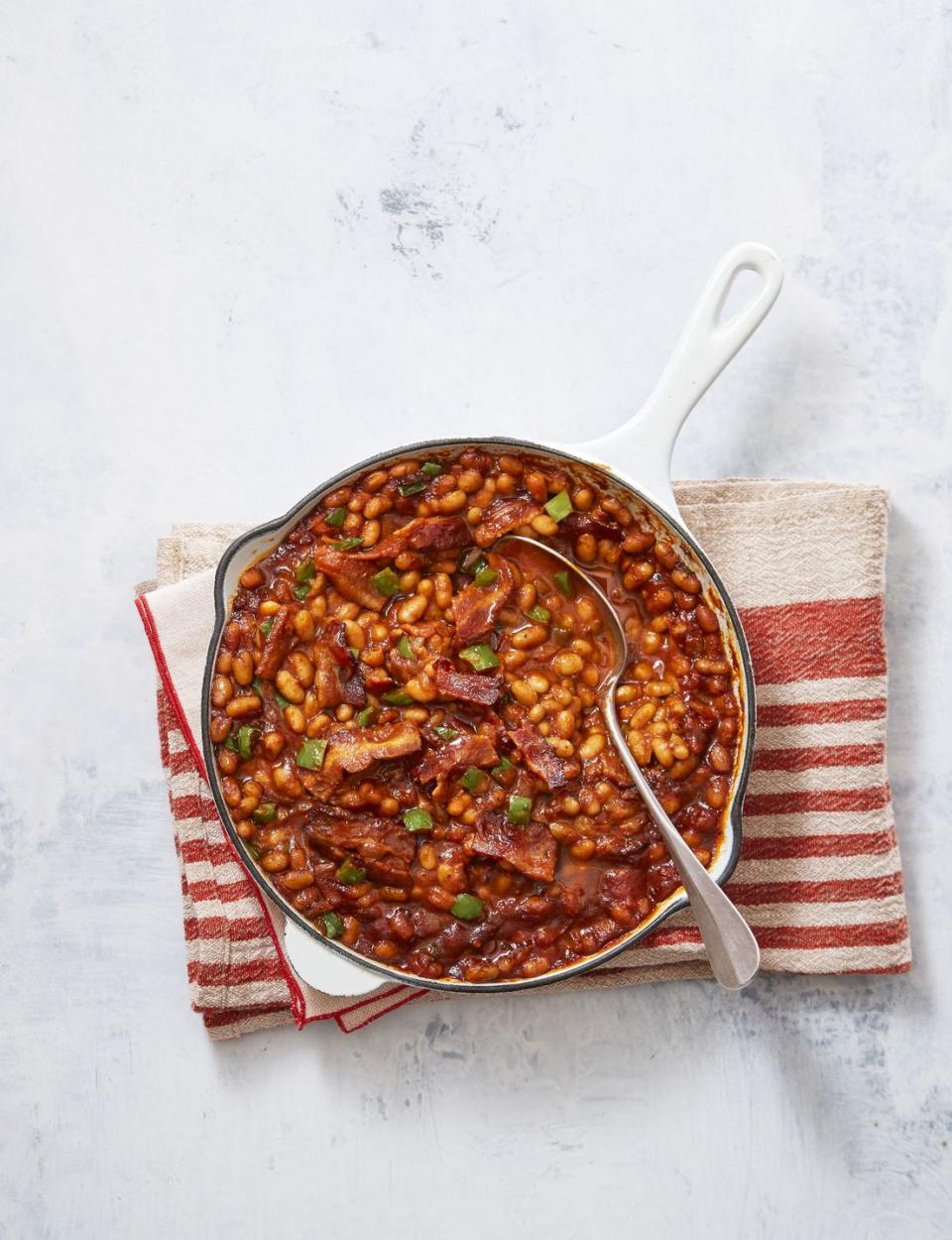 <p>It wouldn't be 4th of July without the beans. They may take an hour to bake, but consider that hands-off time the perfect opportunity to actually <em>enjoy</em> your BBQ.</p><p><em><a href="https://www.goodhousekeeping.com/food-recipes/a39271/campfire-baked-beans-recipe/" rel="nofollow noopener" target="_blank" data-ylk="slk:Get the recipe for Campfire Baked Beans »;elm:context_link;itc:0;sec:content-canvas" class="link ">Get the recipe for Campfire Baked Beans »</a></em></p>