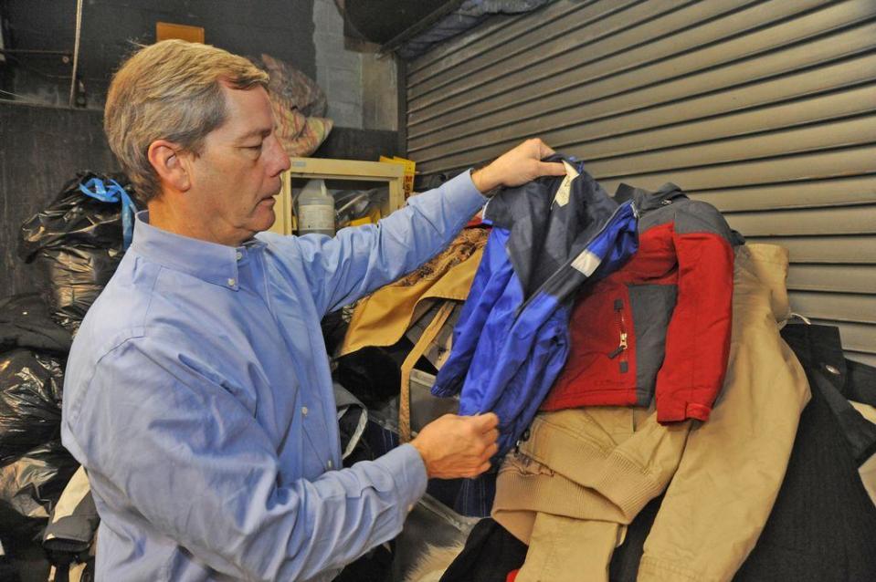 Terry Dermody owner of Dermody Cleaners looks over some donated children's coats during the 2017 coat drive.