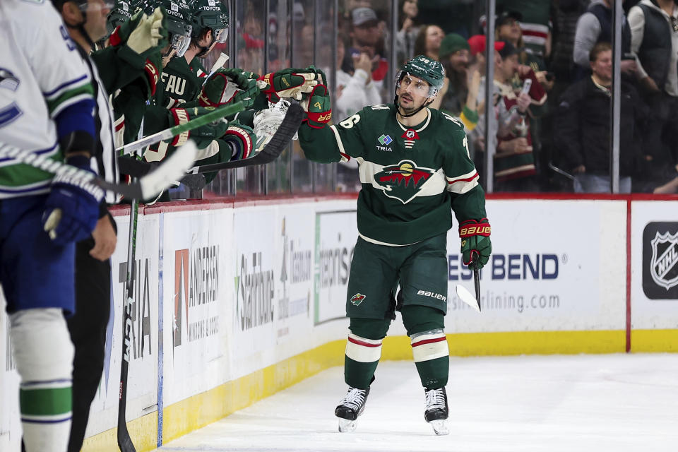 Minnesota Wild right wing Mats Zuccarello celebrates his goal against the Vancouver Canucks during the second period of an NHL hockey game, Monday, Feb. 19, 2024, in St. Paul, Minn. (AP Photo/Matt Krohn)
