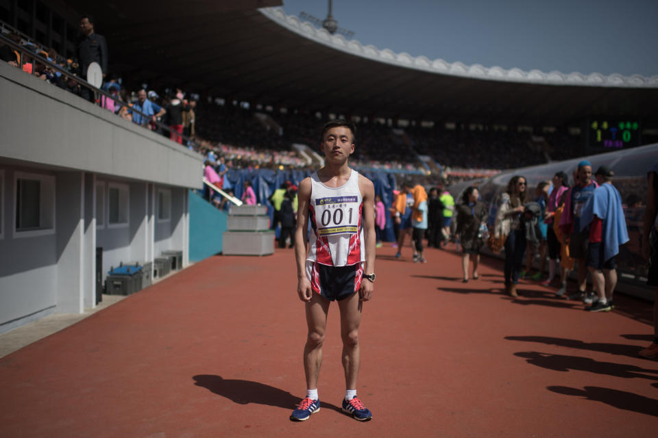 Marathon runner Pak Chol poses for a portrait after winning the Pyongyang Marathon, at Kim Il-Sung stadium in Pyongyang.