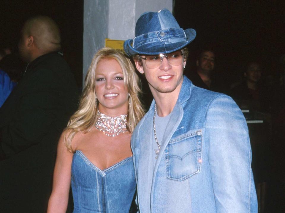<p>Jeffrey Mayer/WireImage</p> Britney Spears and Justin Timbelake wearing coordinating denim looks to the 2001 American Music Awards.