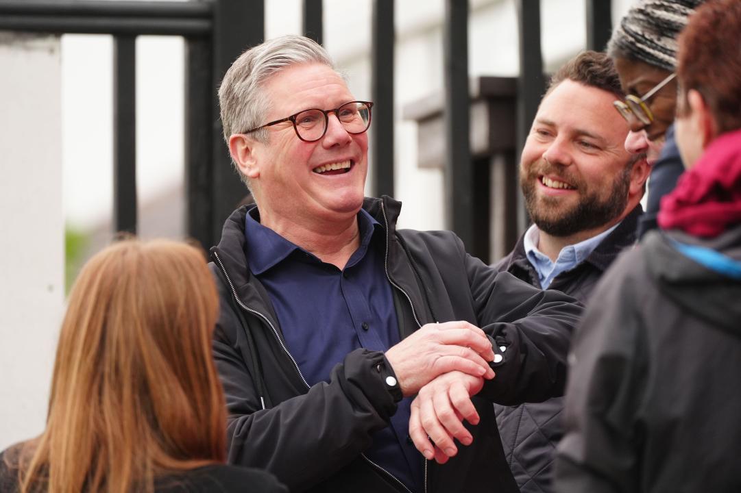 Labour leader Sir Keir Starmer looks at his watch as he celebrates at Blackpool Cricket Club after Chris Webb was declared winner in the Blackpool South by-election. The by-election was triggered after the resignation of Scott Benton. Picture date: Friday May 3, 2024.