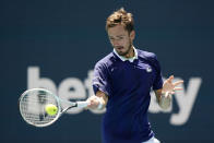 Daniil Medvedev of Russia returns a shot from Pedro Martinez of Spain, during the Miami Open tennis tournament, Monday, March 28, 2022, in Miami Gardens, Fla. (AP Photo/Wilfredo Lee)