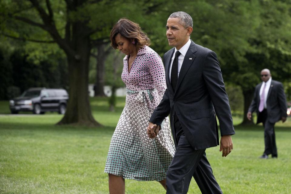 President Barack Obama and first lady Michelle Obama arrive at the White House in Washington, Thursday, May 15, 2014, from a trip to New York City. (AP Photo/Manuel Balce Ceneta)