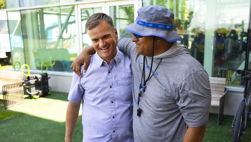 Nick Greer, co-founder of Built Brands, left, and BYU football coach Kalani Sitake greet each other during a press conference at the BYU Student Athlete Building in Provo on Friday, Aug. 13, 2021, where they discussed Built Brands’ name, image and likeness agreement with BYU.
