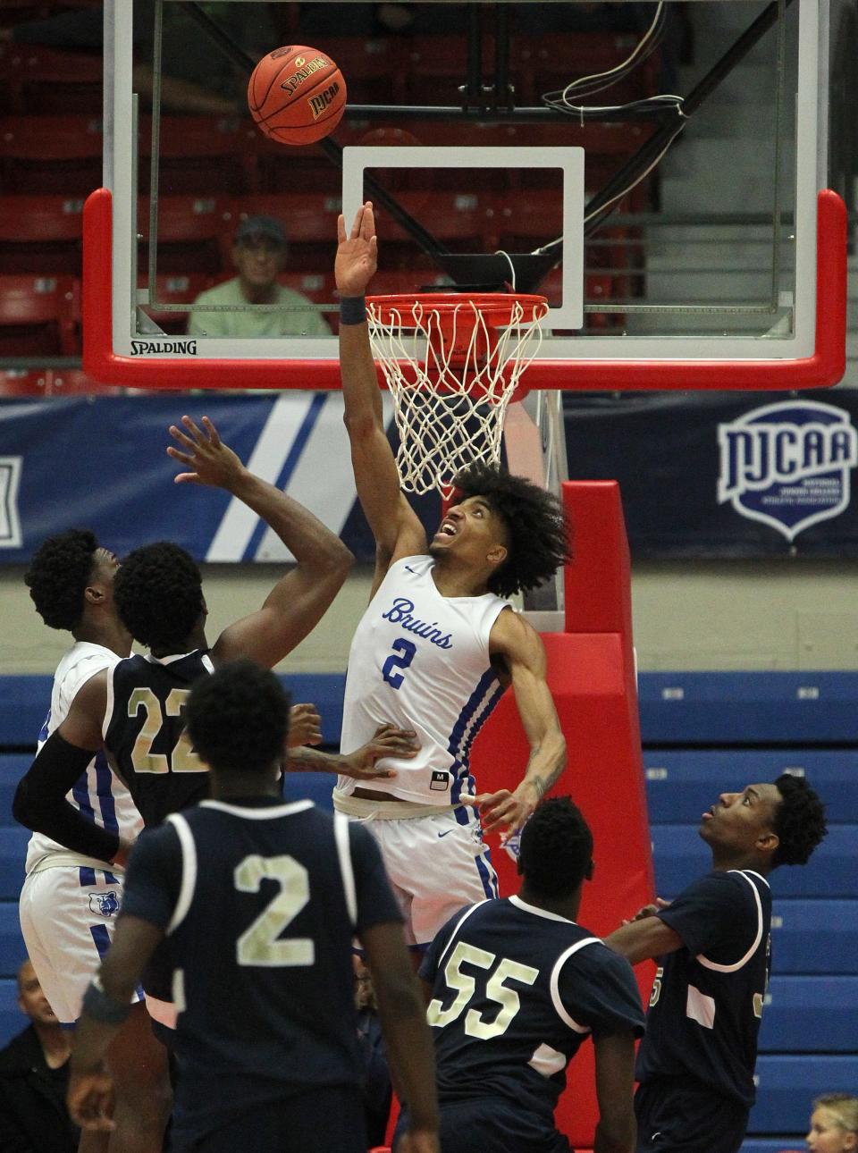 Salt Lake's Jaquan Scott (2) blocks the shot of Chipola's Faizon Fields (22) during their NJCAA Division I Men's Basketball Tournament semifinal game Friday, March 18, 2022, at the Sports Arena. Salt Lake defeated Chipola 70-68. 