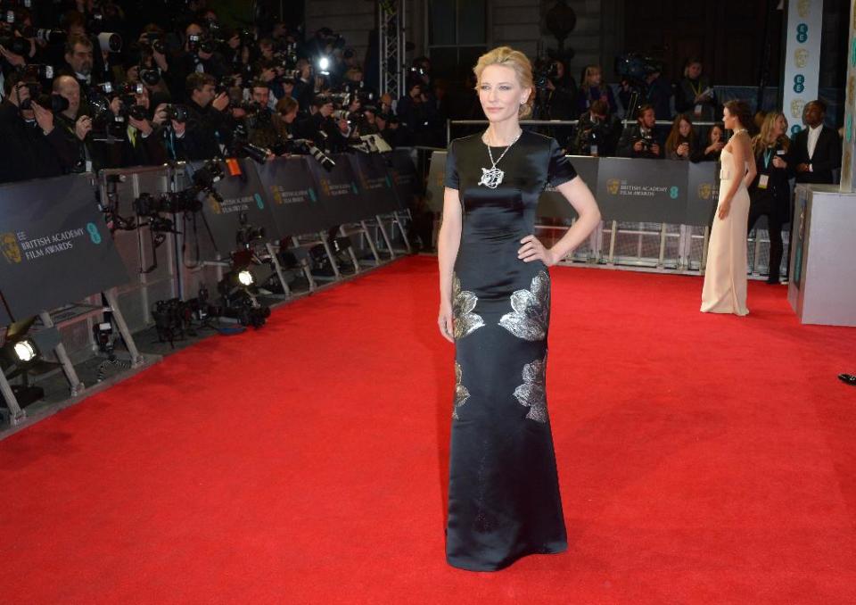 Australian actress Cate Blanchett poses for photographers on the red carpet at the EE British Academy Film Awards held at the Royal Opera House on Sunday Feb. 16, 2014, in London. (photos by Jon Furniss/Invision/AP)