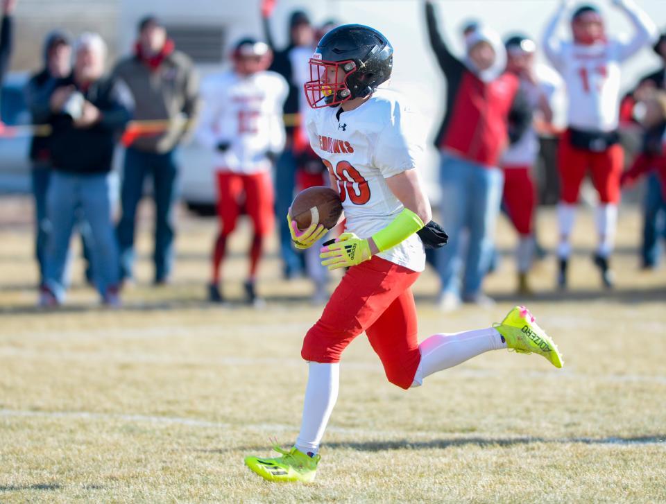 Froid/Medicine Lake's Austen Hobbs crosses the goal line for a rushing touchdown in Saturday's 6-player championship foorball game against Power/Dutton/Brady.