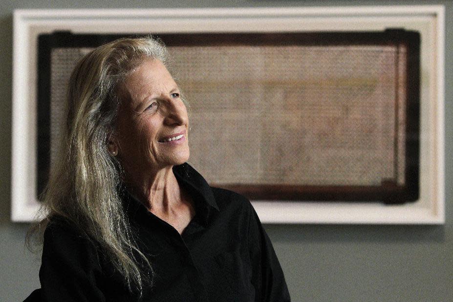 Annie Leibovitz answers questions during an interview before the opening of her exhibition at the Wexner Center for the Arts Friday, Sept. 21, 2012, in Columbus, Ohio. Leibovitz's exhibition features work from her “Master Set,” an authoritative edition of 156 images. (AP Photo/Jay LaPrete)