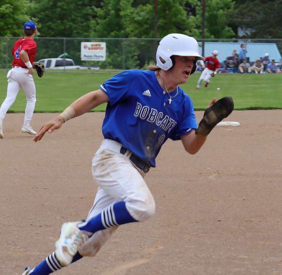 Cambridge senior Keaton Kyser (3) rounds third base during the Division II sectional baseball game against West Holmes at Don Coss Stadium Tuesday evening.