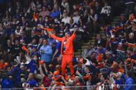 Fans cheer during the first period of Game 3 of an NHL hockey second-round playoff series between the New York Islanders and the Boston Bruins on Thursday, June 3, 2021, in Uniondale, N.Y. (AP Photo/Frank Franklin II)