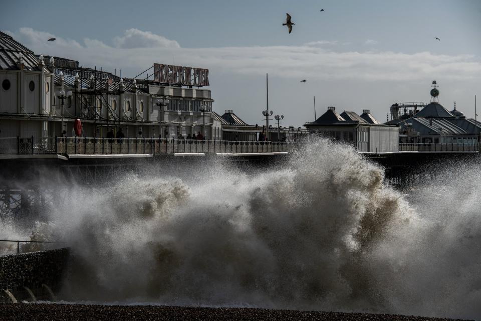 Waves crash on the beach next to Brighton pier as high winds continue following Storm Ciara (Getty Images)