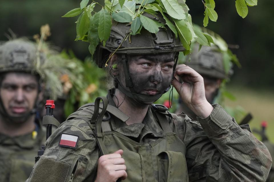 Volunteers takes part in basic training with the Polish army in Nowogrod, Poland, on Thursday June 20, 2024. Poland’s army has launched a program this summer called “Holidays with the Army” to train young volunteers in combat. Nations along NATO’s eastern flank are strengthening their defenses while fearing that Russia could one day attack them if it prevails in neighboring Ukraine. (AP Photo/Czarek Sokolowski)