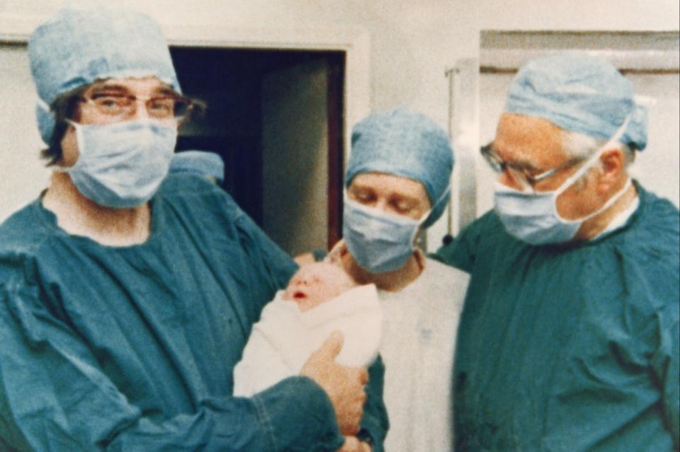 Cambridge physiologist Dr Robert Edwards holding the world's first test tube baby Louise Joy Brown (Getty Images)