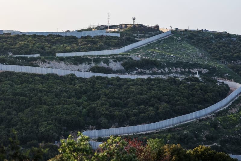A general view of the Israeli-Lebanese border wall, after an intercepted rocket fired from Lebanon hit northern Israel. Two Israeli reservists have been killed in a drone attack by the Lebanese Shiite militia Hezbollah, the Israeli army said on Tuesday. Ilia Yefimovich/dpa