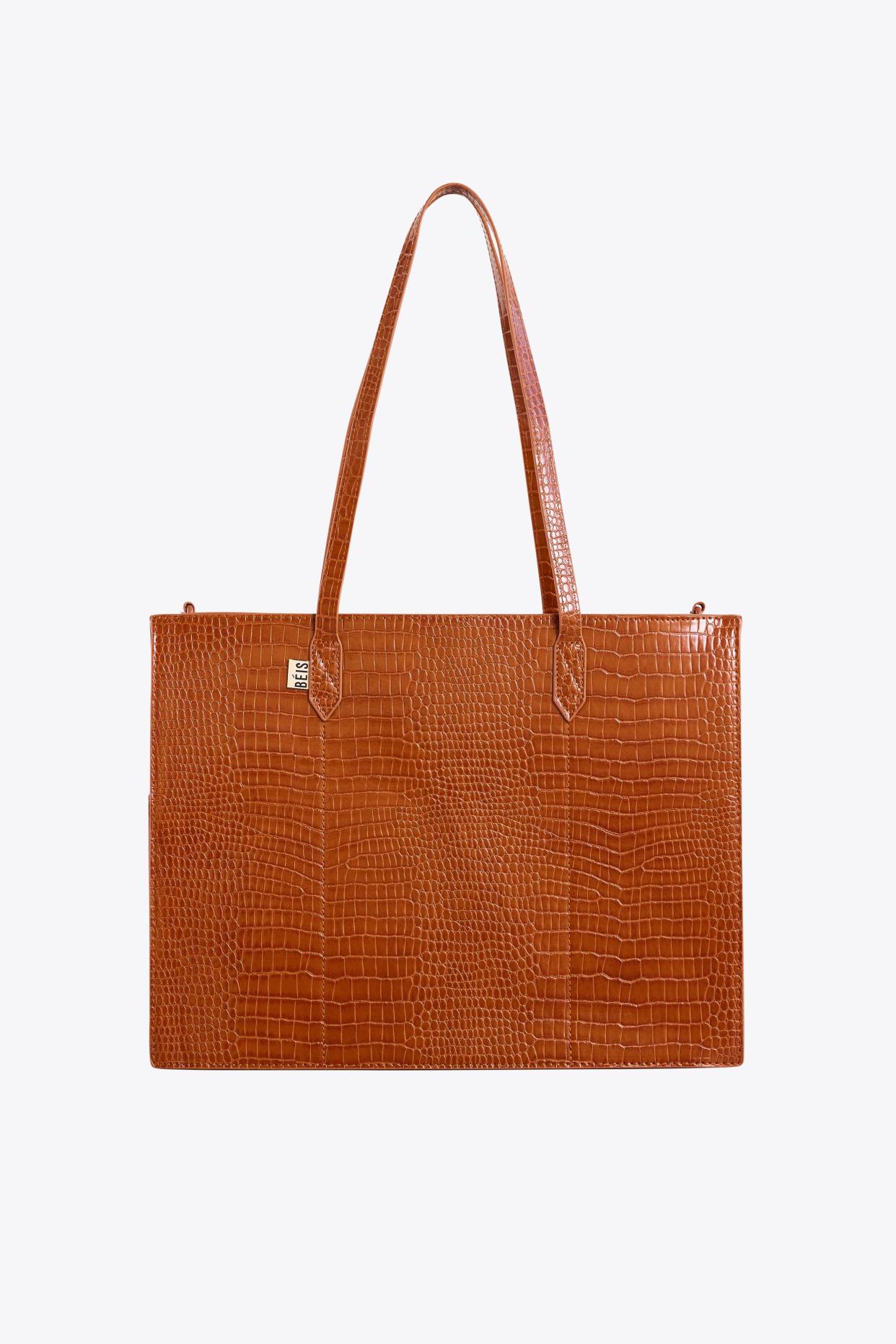 <p><a href="https://go.redirectingat.com?id=74968X1596630&url=https%3A%2F%2Fbeistravel.com%2Fproducts%2Fthe-work-tote-in-cognac-croc&sref=https%3A%2F%2Fwww.townandcountrymag.com%2Fstyle%2Ffashion-trends%2Fg45440579%2Fbest-laptop-bags-for-women%2F" rel="nofollow noopener" target="_blank" data-ylk="slk:Shop Now;elm:context_link;itc:0;sec:content-canvas" class="link rapid-noclick-resp">Shop Now</a></p><p>The Work Tote in Cognac Croc</p><p>beistravel.com</p><p>$128.00</p>