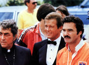 <p>Reynolds was equally as good in racing films as he was in football-centered flicks. He played J.J. McClure in <em>The Cannonball Run </em><em>I </em>and<em> II</em> in the early ’80s. (Photo: Mary Evans/Ronald Grant/Everett Collection) </p>