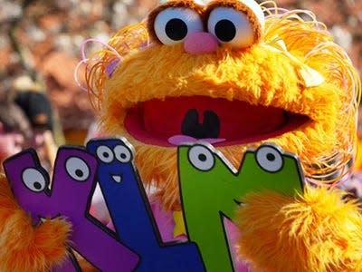 Sesame Street character Zoe beckons teachers to take advantage of the "Teacher Pass" at Sesame Place, which grants free access to the park for an entire year. Here's how teachers can sign up.