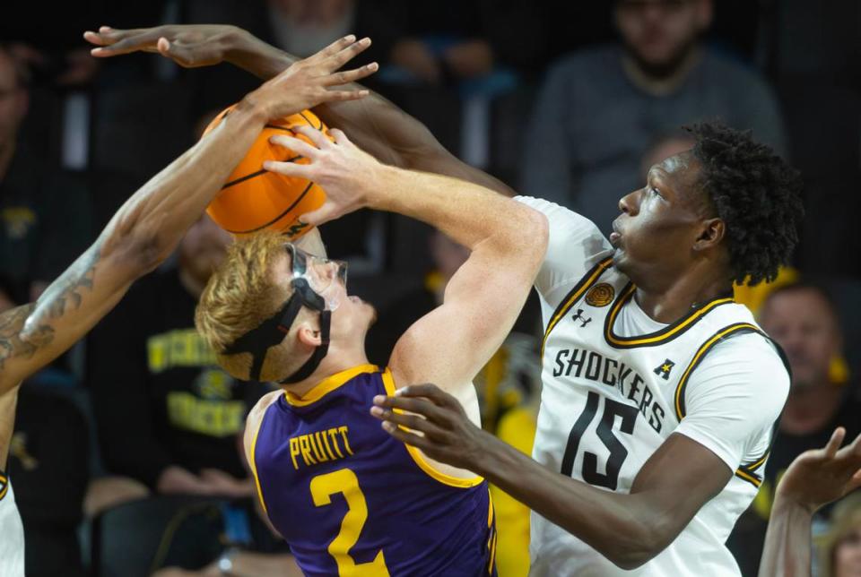 Wichita State’s Ballard blocks the shots of Lipscomb’s Will Pruitt during the first half of their season opener on Monday night at Koch Arena. Travis Heying/The Wichita Eagle