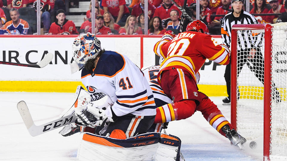 It was ruled that Calgary Flames forward Blake Coleman kicked the puck past Oilers goalie Mike Smith in the late stages of the third period. (Photo by Derek Leung/Getty Images)