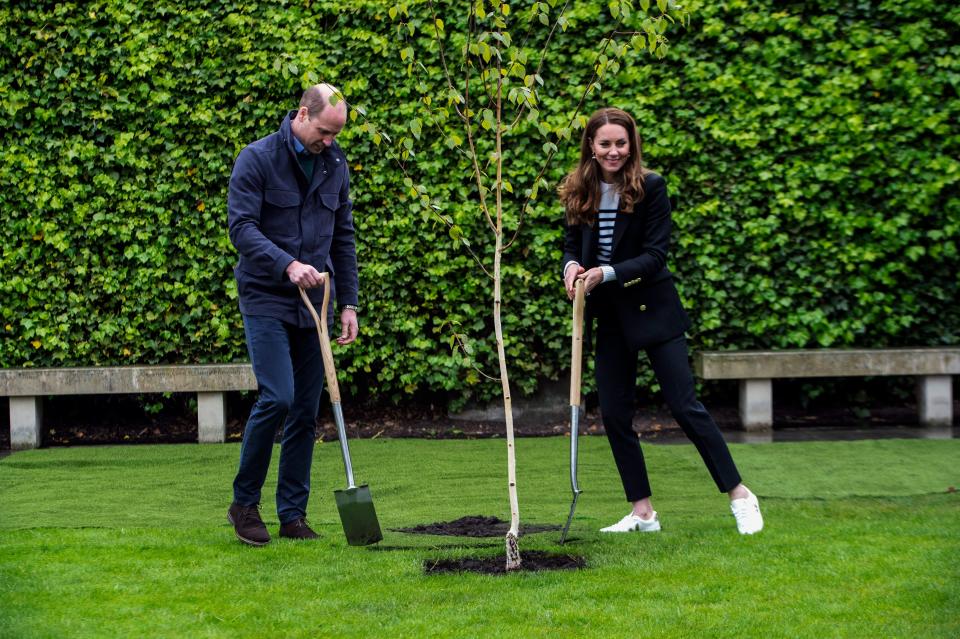 Britain's Catherine, Duchess of Cambridge and Britain's Prince William, Duke of Cambridge, take part in a tree planting ceremony as they visit the University of St Andrews in St Andrews on May 26, 2021. (Photo by Andy Buchanan / POOL / AFP) (Photo by ANDY BUCHANAN/POOL/AFP via Getty Images)