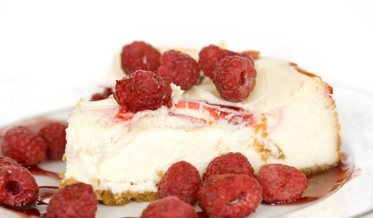 A slice of raspberry cheesecake.