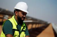 Hossam Hussein, an engineer of Taqa Solar speaks during an interview with Reuters at the Benban plant in Aswan