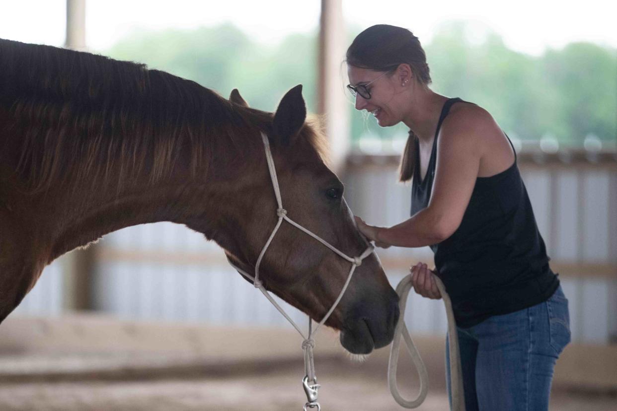 The bond between Titus and Samantha Schneider is easy to see as she uses a light rein and clicking noises to train him at Rainbow Meadows.