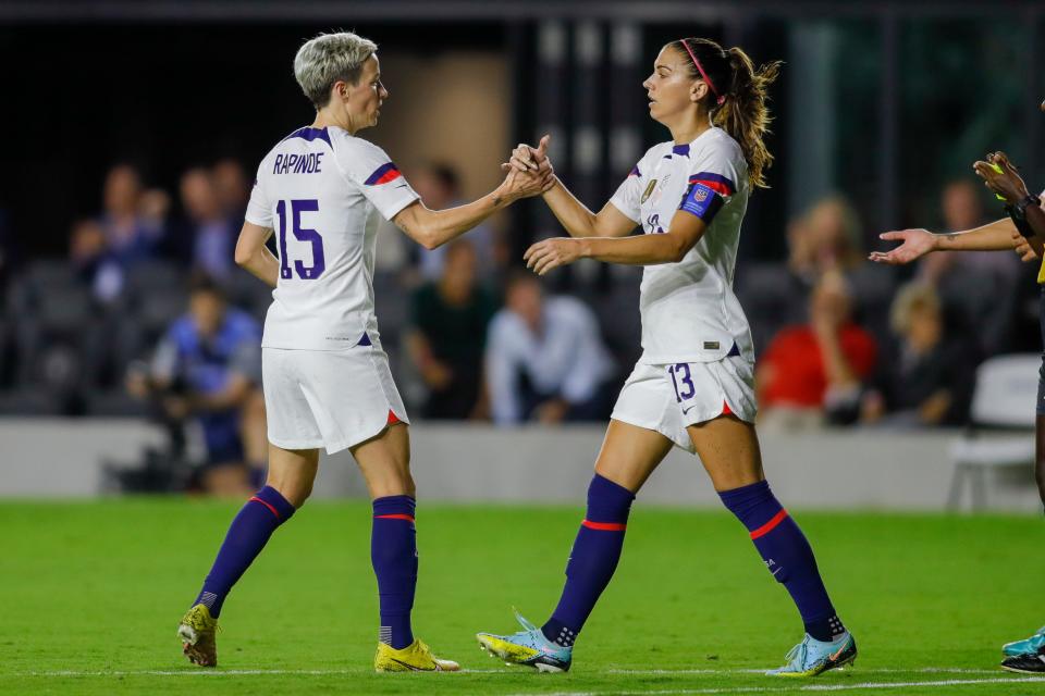 USWNT forward Megan Rapinoe (15) celebrates with forward Alex Morgan (13) after scoring during a game against Germany on Nov. 10, 2022.