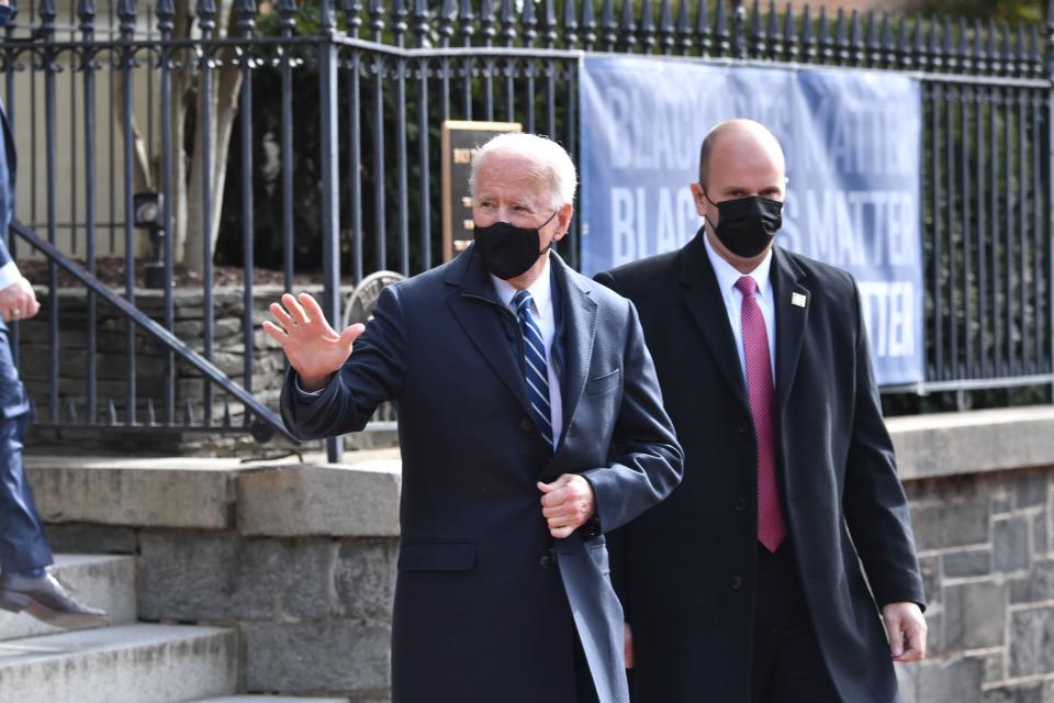 Mr Biden first attended mass - then stopped at a bakery  (AFP via Getty Images)