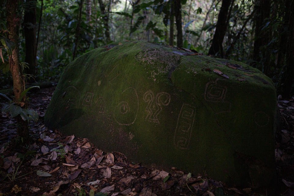 A recently rediscovered stone with petroglyphs, found near the Piatúa River in April. People from the resistance talked with archeologist Carlos Duche, who said that these reflect some of the petroglyphs in the region, extending from the province of Napo down to province of Morona Santiago to the South of the Piatúa River, proving the existence of native people in the region for millennia. It is pre-Columbian, probably from around 800 BC and shares symbols with the other petroglyphs in the region. The spiral, for example, represents the spiral of the seasons, of the traditional woven rooves, and of life.<span class="copyright">Andrés Yépez for TIME</span>