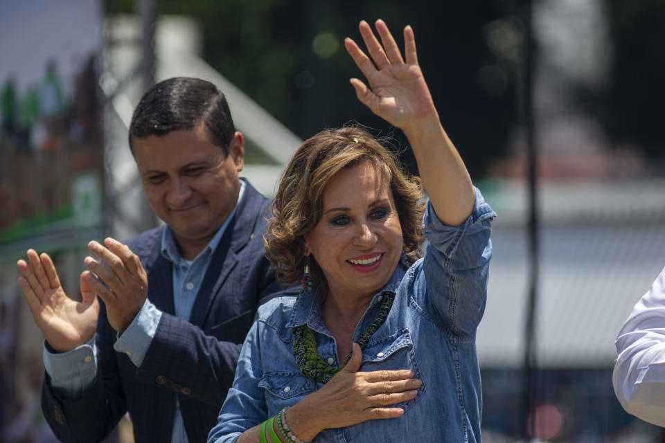 Sandra Torres, presidential candidate of the National Unity of Hope party, UNE, waves to supporters during her closing campaign rally prior to Sunday's general elections, in Villanueva, Guatemala, Friday, June 14, 2019. (AP Photo/Moises Castillo)