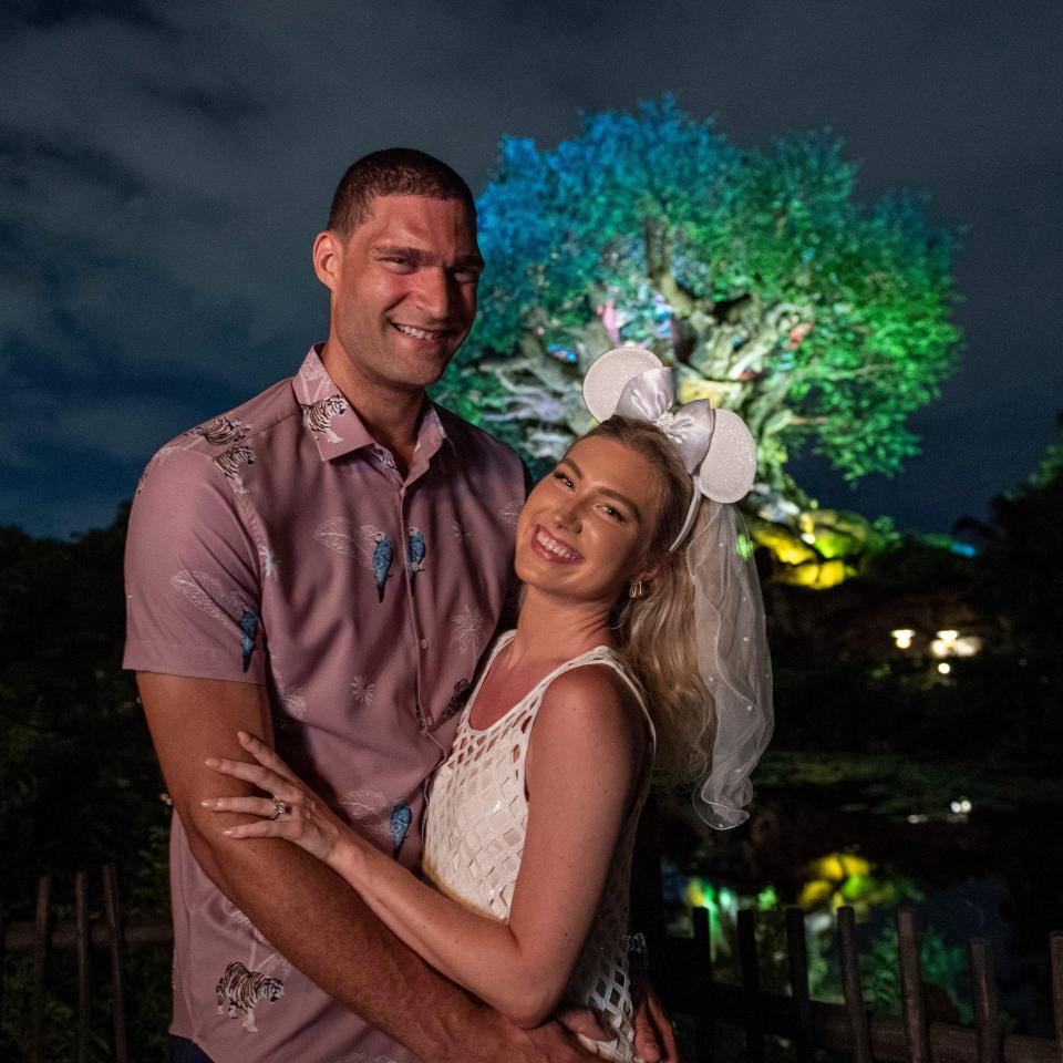 Brook Lopez of the Milwaukee Bucks proposed to his longtime girlfriend, Hailee Nicole Strickland, in front of the Tree of Life at Disney's Animal Kingdom Theme Park in Florida on Aug. 15, 2022.