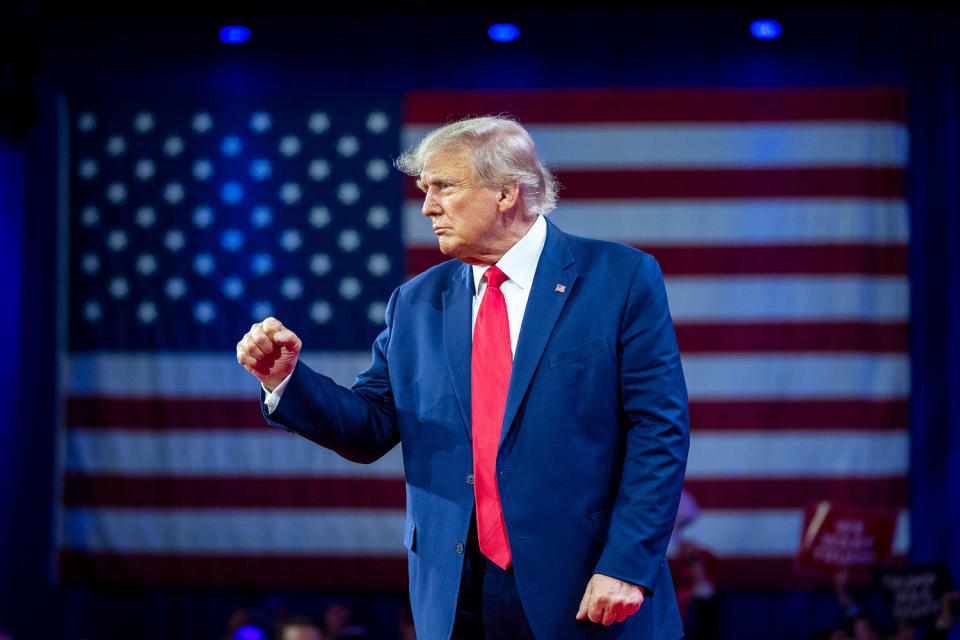 Donald Trump pumps his fist as he departs after speaking at the Conservative Political Action Conference in March 2023. (Alex Brandon / AP file)