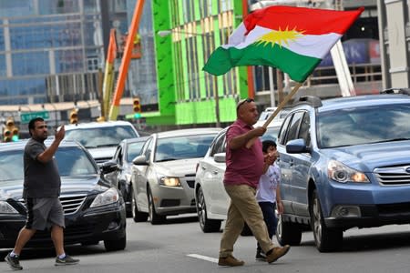 A crowd of over 500 people protest in support of Kurds after the Trump administration changed its policy in Syria