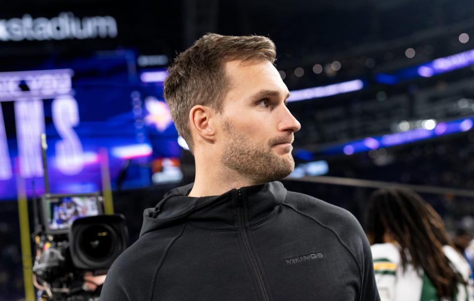 MINNEAPOLIS, MINNESOTA - DECEMBER 31: Kirk Cousins #8 of the Minnesota Vikings greets players on the field after the game against the Green Bay Packers at U.S. Bank Stadium on December 31, 2023 in Minneapolis, Minnesota. (Photo by Stephen Maturen/Getty Images)