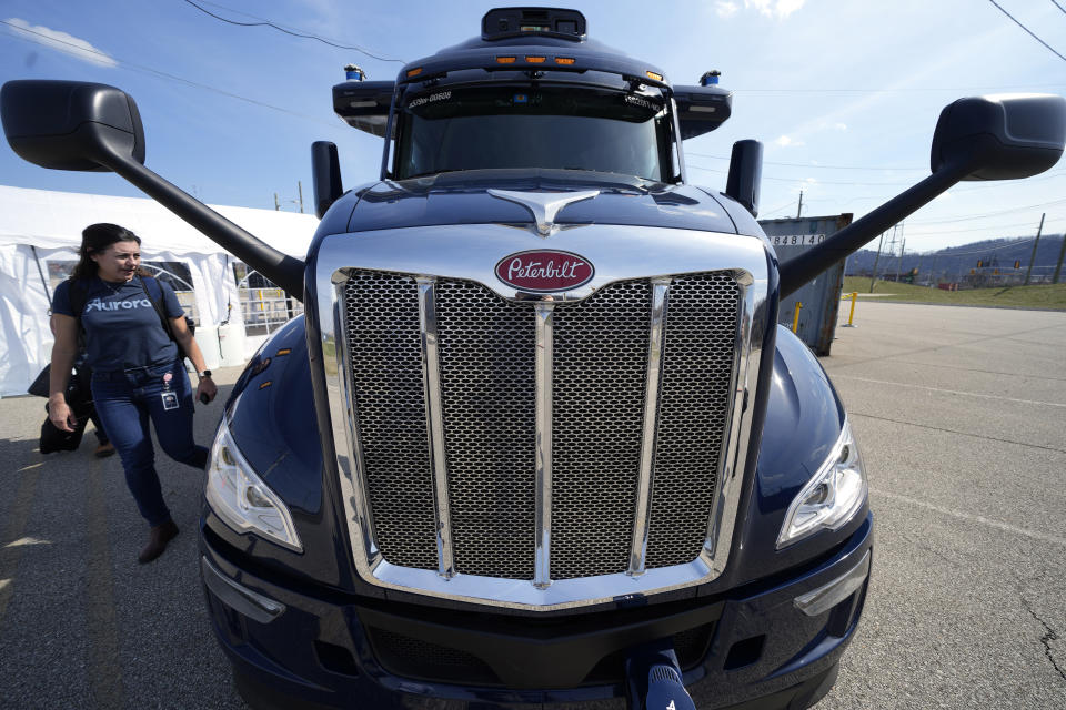 A self-driving tractor trailer is displayed at a test track in Pittsburgh, Thursday, March 14, 2024. The truck, outfitted with 25 laser, radar and camera sensors, is owned by Pittsburgh-based Aurora Innovation Inc. Late this year, Aurora plans to start hauling freight on Interstate 45 between the Dallas and Houston areas with 20 driverless trucks. (AP Photo/Gene J. Puskar)