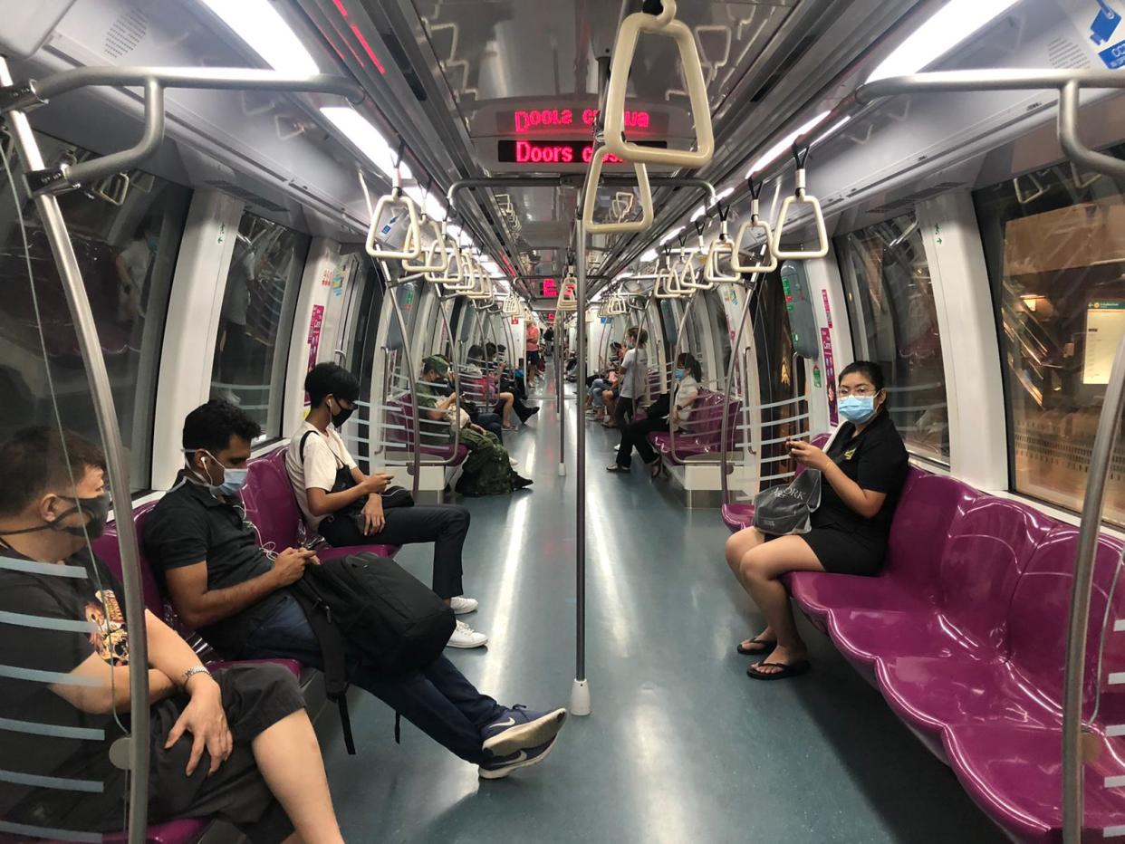 Commuters on an MRT train during COVID-19 enhanced safe distancing period. (PHOTO: Dhany Osman/Yahoo News Singapore)