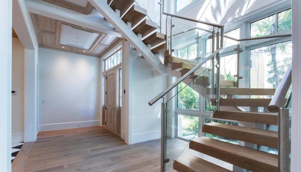 A contemporary-style floating staircase is featured in a townhome at 218 Brazilian Ave., which is listed for sale by Sotheby's International Realty. The townhouse next door at 220 Brazilian Ave., which just sold for a recorded $14.35 million, has an identical staircase.