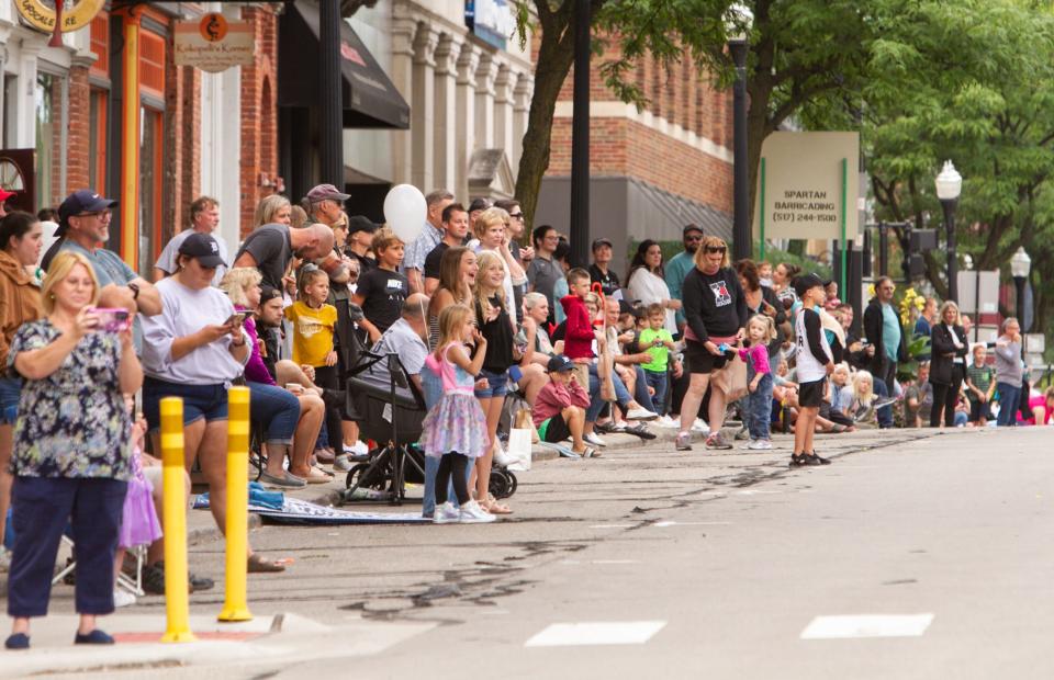 Crowds line Grand River Avenue in downtown Howell for the Melon Festival Parade in 2022.