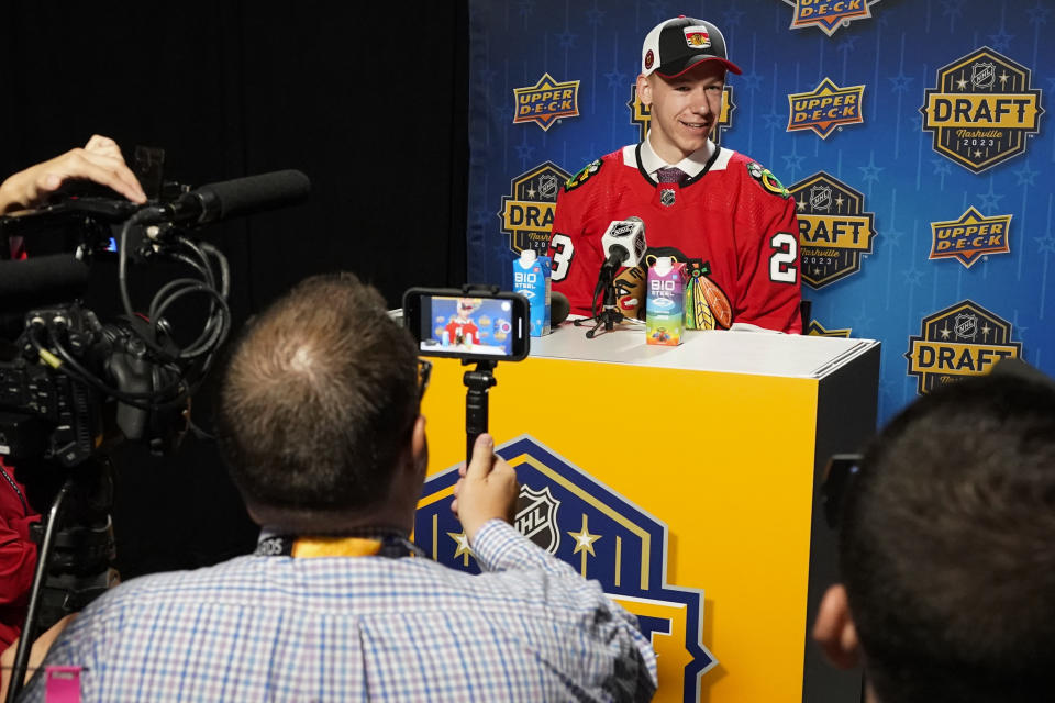 Adam Gajan speaks to the media after being picked by the Chicago Blackhawks during the second round of the NHL hockey draft Thursday, June 29, 2023, in Nashville, Tenn. (AP Photo/George Walker IV)