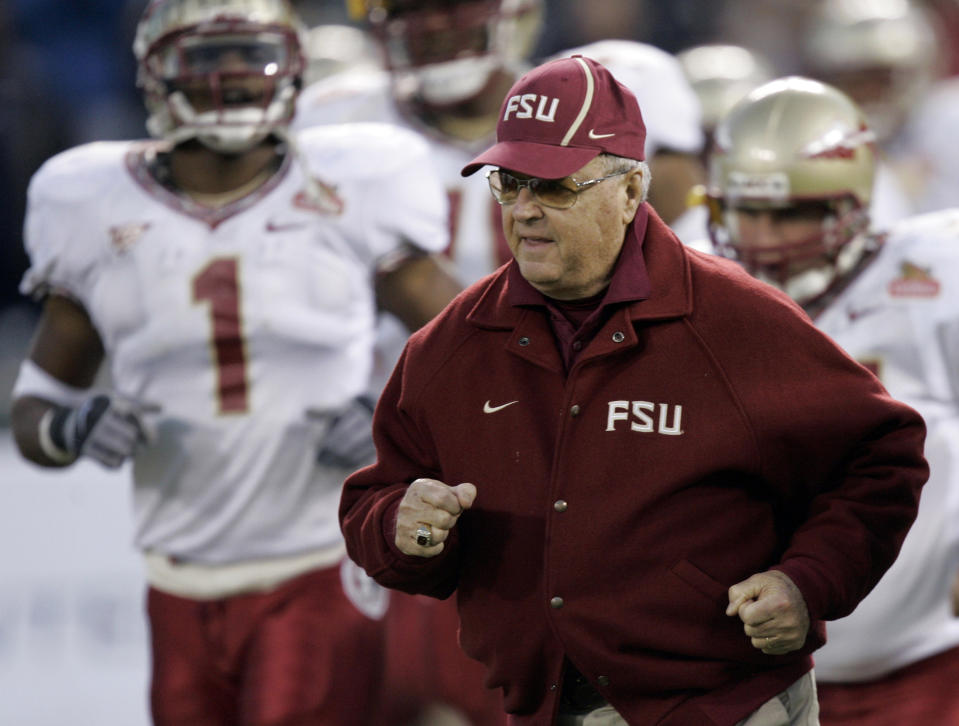 FILE - In this Dec. 27, 2006, file photo, Florida State head coach Bobby Bowden runs unto the field with his team as they get ready to play UCLA at the start the Emerald Bowl college football game in San Francisco. Florida State's folksy and affable coach turned the Seminoles into a national powerhouse and he is as responsible as anyone for making the phrase, 'Dag'gummit' a part of college football's lexicon. (AP Photo/Marcio Jose Sanchez, File)