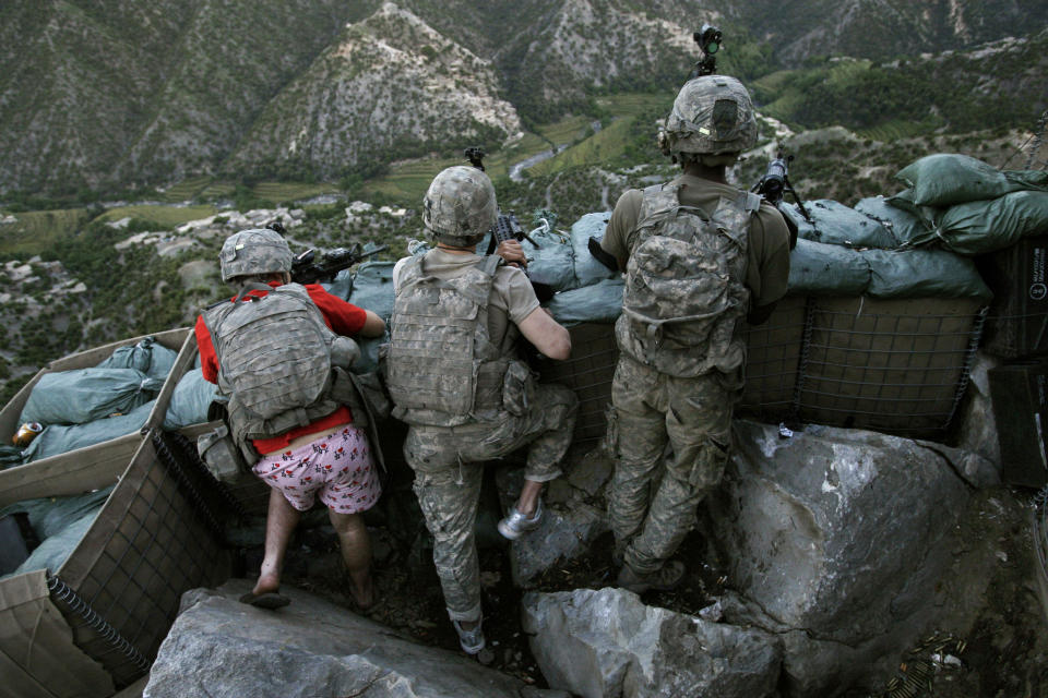 FILE - U.S. soldier Zachary Boyd of Fort Worth, Texas, wears "I love NY" boxer shorts as his platoon takes defensive positions after Taliban fighters attacked the Restrepo firebase in the Korengal Valley, Afghanistan, May 11, 2009. (AP Photo/David Guttenfelder, File)
