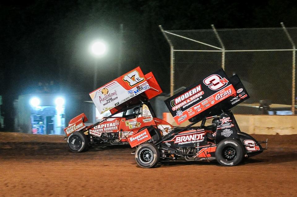 Eventual winner Bill Balog (17) races Jake Neuman for the lead in the A feature at the IRA Sprints Road America Challenge event Thursday night at Plymouth Dirt Track at the Sheboygan County Fairgrounds.