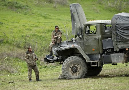 Servicemen of the self-defense army of Nagorno-Karabakh rest at their position in the village of Talish April 6, 2016. REUTERS/Staff