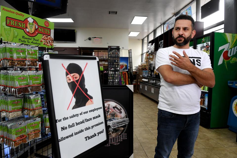 George Touma, co-owner of House of Smokes in Ventura with his brother Nadim Touma, stands in the shop on Tuesday, May 14, 2024. The brothers have added new security measures over the years after a number of break-ins.