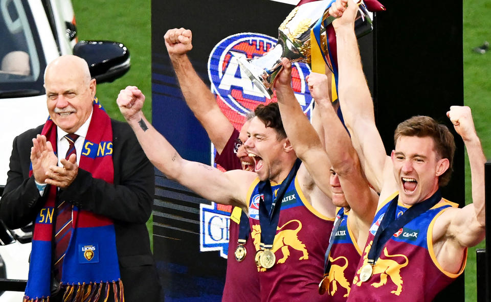 Leigh Matthews, pictured here after presenting the premiership cup to the Lions.