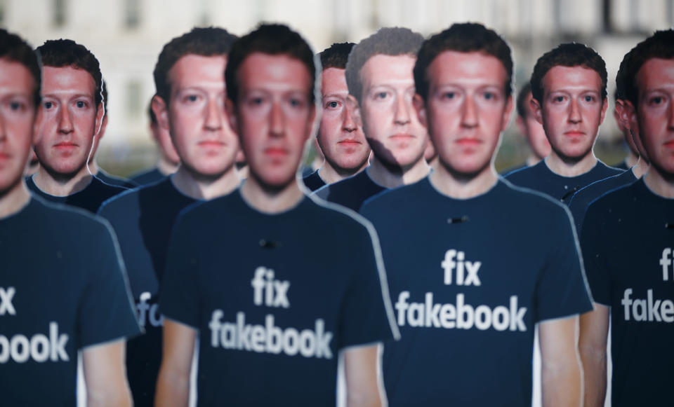 Life-sized cutouts of Facebook CEO Mark Zuckerberg wearing 'Fix Fakebook' t-shirts are displayed by advocacy group, Avaaz, on the South East Lawn of the Capitol on Capitol Hill in Washington, Tuesday, April 10, 2018, ahead of Zuckerberg's appearance before a Senate Judiciary and Commerce Committees joint hearing. (AP Photo/Carolyn Kaster)