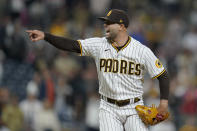 San Diego Padres relief pitcher Nick Martinez reacts after getting the last out in the ninth inning of a baseball game against the San Francisco Giants, Tuesday, Oct. 4, 2022, in San Diego. The Padres won, 6-2. (AP Photo/Gregory Bull)